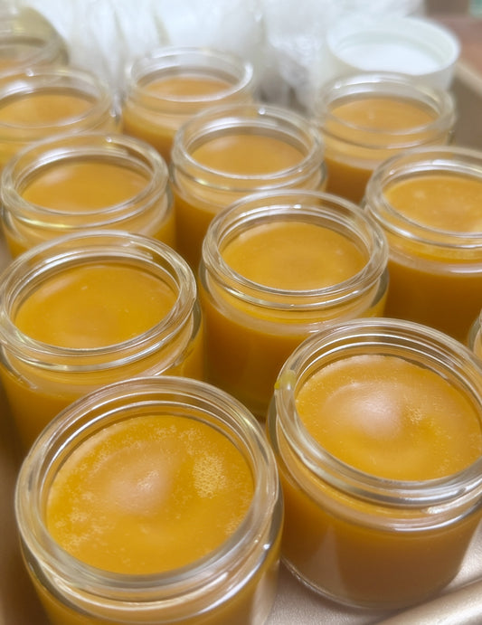 Jars of Surf Balm without cap on on a metal tray