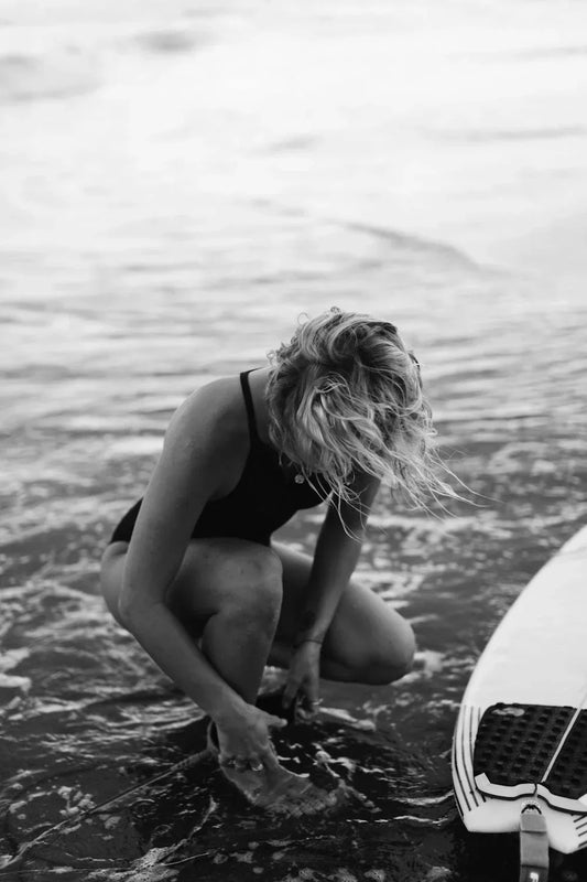 black and white image of surfer