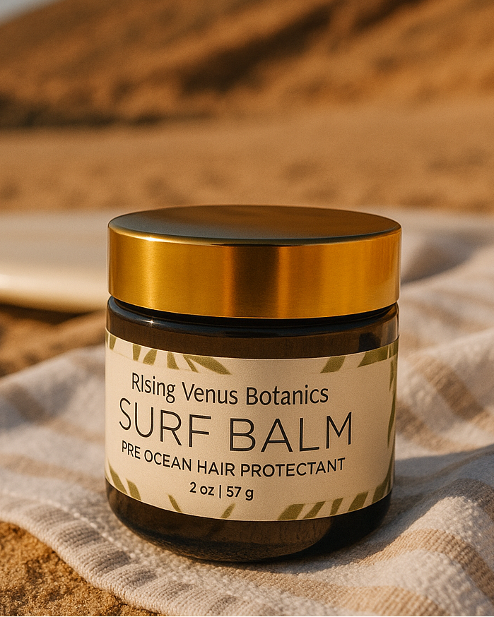 Jar of Rising Venus Botanics Surf Balm on a sandy background
